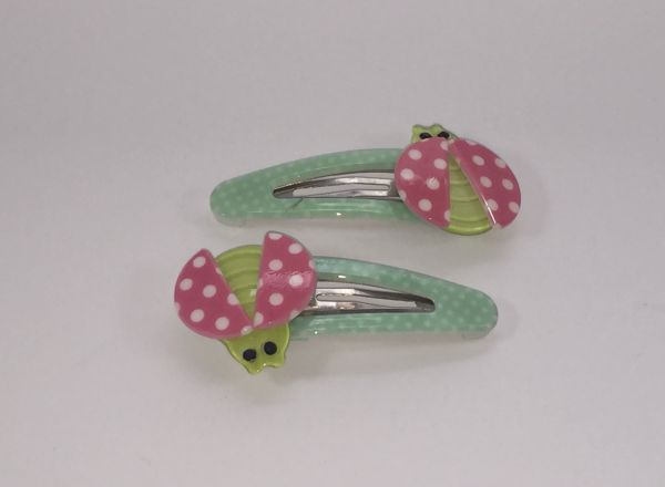 Patterned snap clip with patterned ladybird