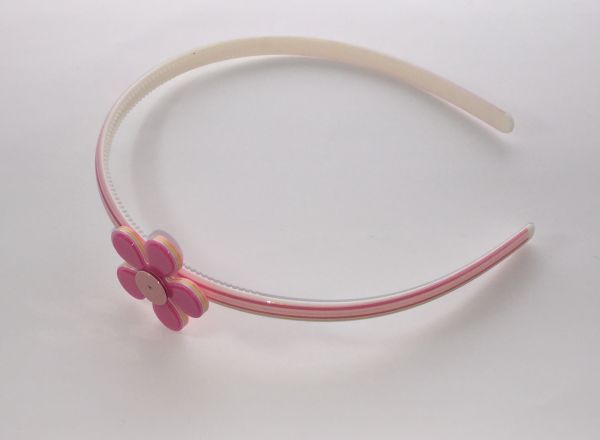 Polka dots patterned headband with flower shape