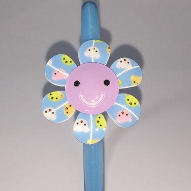 Head band with patterned flower shape