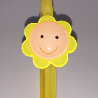Head band with face patterned flower